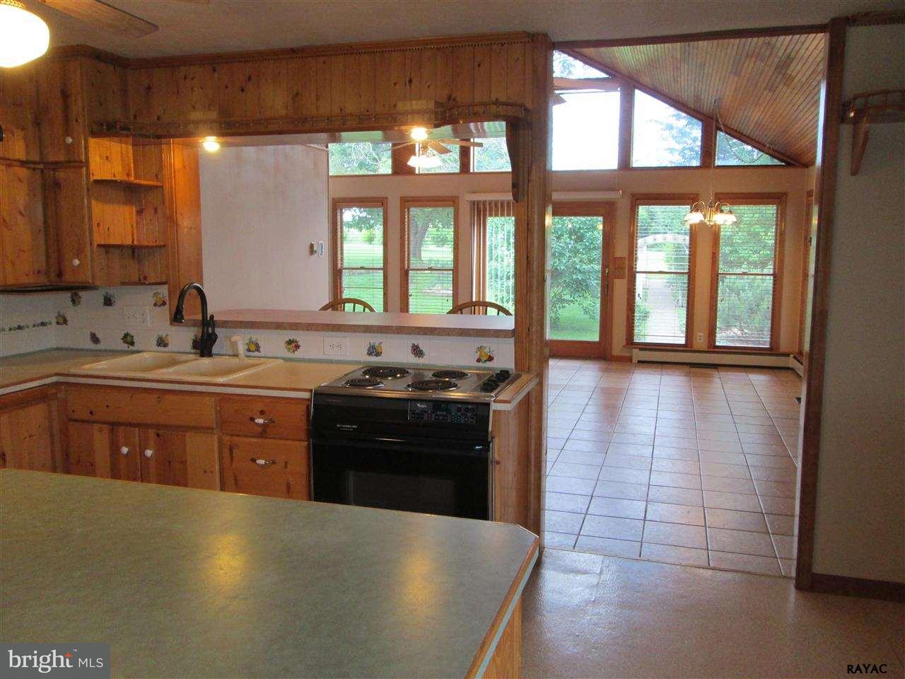 881 Pine Grove Road Hanover, PA 17331 - Photo 16 of 35 a large kitchen with stainless steel appliances granite countertop a stove a sink and a granite counter tops with a large window