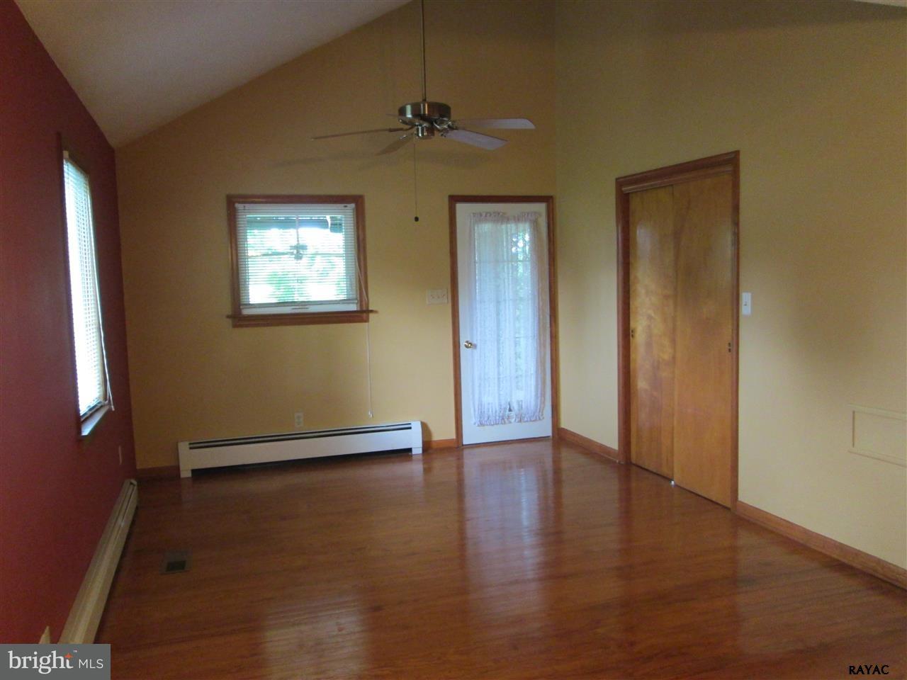 881 Pine Grove Road Hanover, PA 17331 - Photo 26 of 35 an empty room with wooden floor and windows