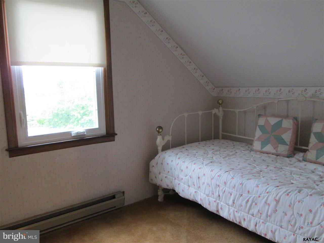 881 Pine Grove Road Hanover, PA 17331 - Photo 31 of 35 a bedroom with a bed and a window