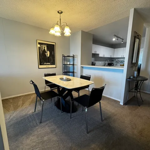 a view of a dining room with furniture