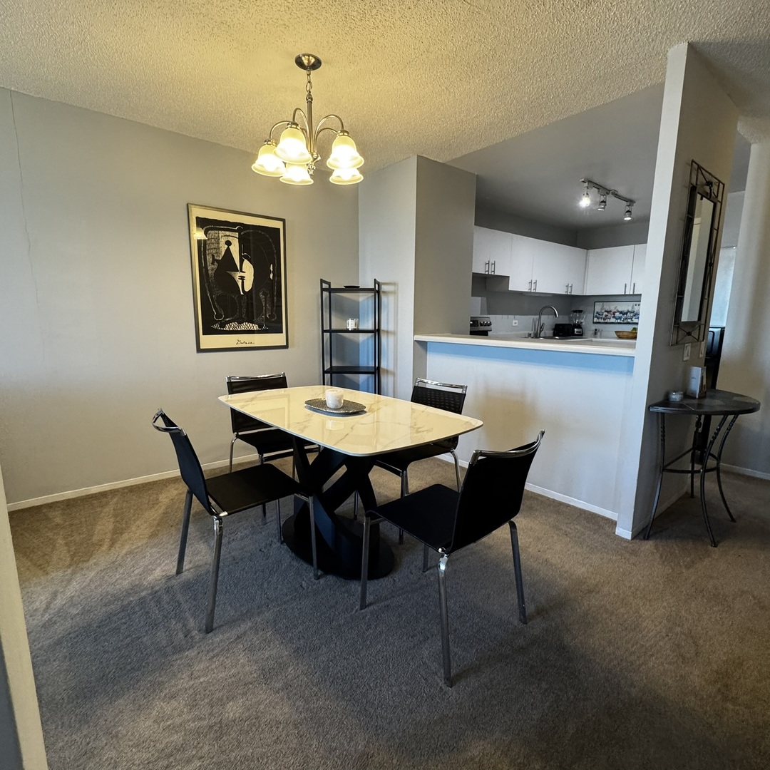 5320 North Sheridan Road, Unit 2001 Chicago, IL 60640 - Photo 5 of 14 a view of a dining room with furniture