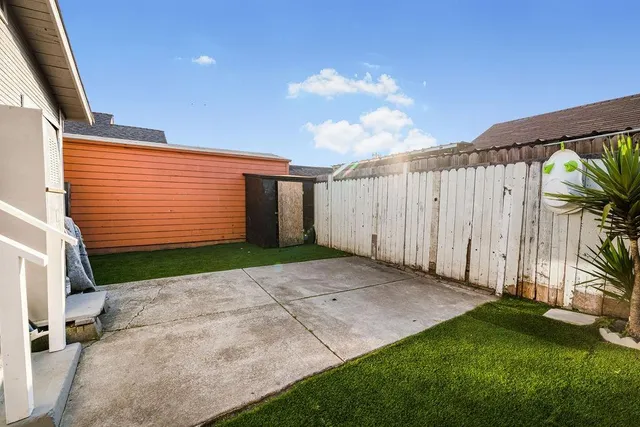 a view of backyard with garage