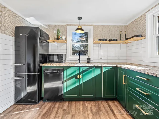 a kitchen with cabinets and a window