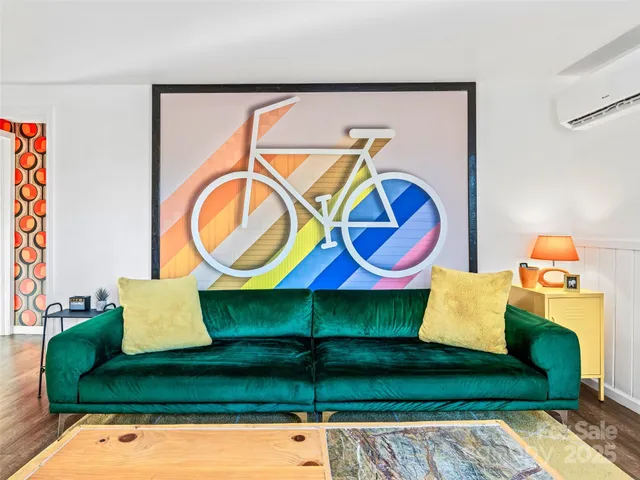 a wooden bench sitting next to a wall