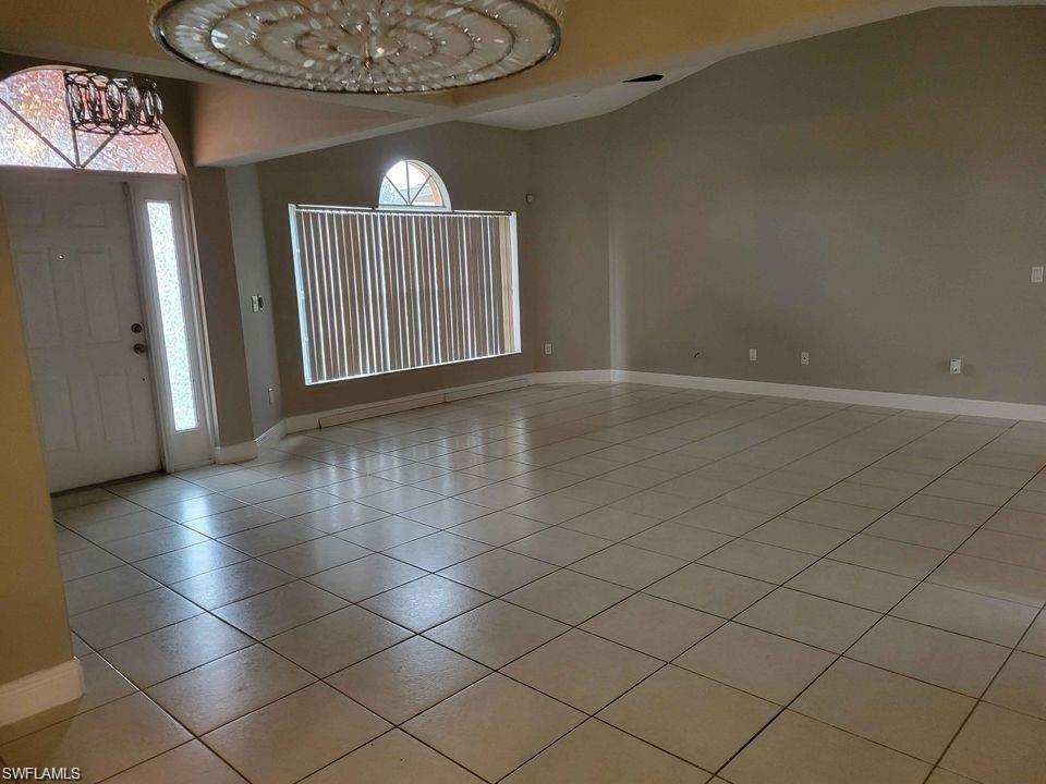 4209 30th Street Southwest Lehigh Acres, FL 33976 - Photo 13 of 13 an empty room with windows