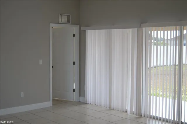 a view of a bathroom with a shower curtain