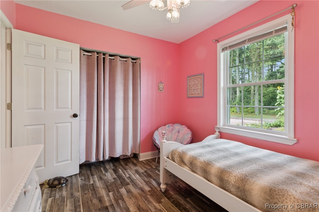 2063 Riley Lane Hayes, VA 23072 - Photo 19 of 35 Bedroom featuring dark wood-style flooring and multiple windows
