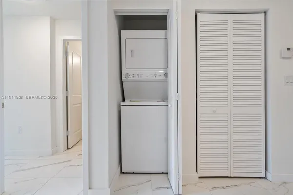 a view of hallway with washer and dryer