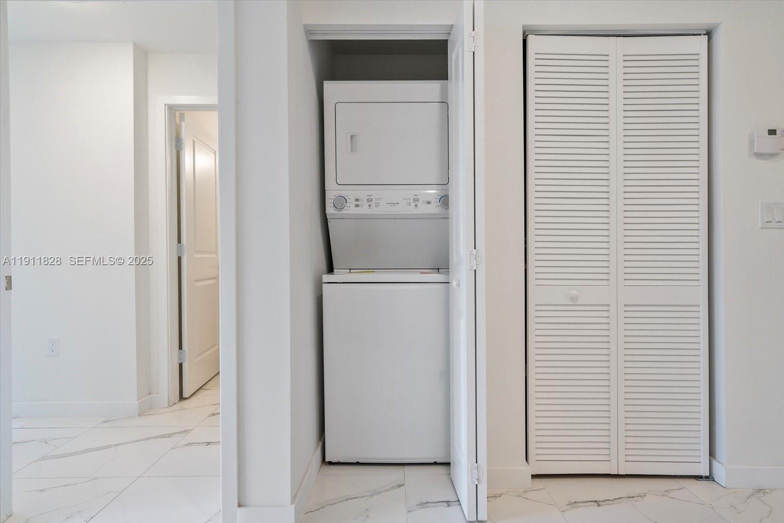 420 Southwest 7th Avenue, Unit 203 Miami, FL 33130 - Photo 6 of 15 a view of hallway with washer and dryer
