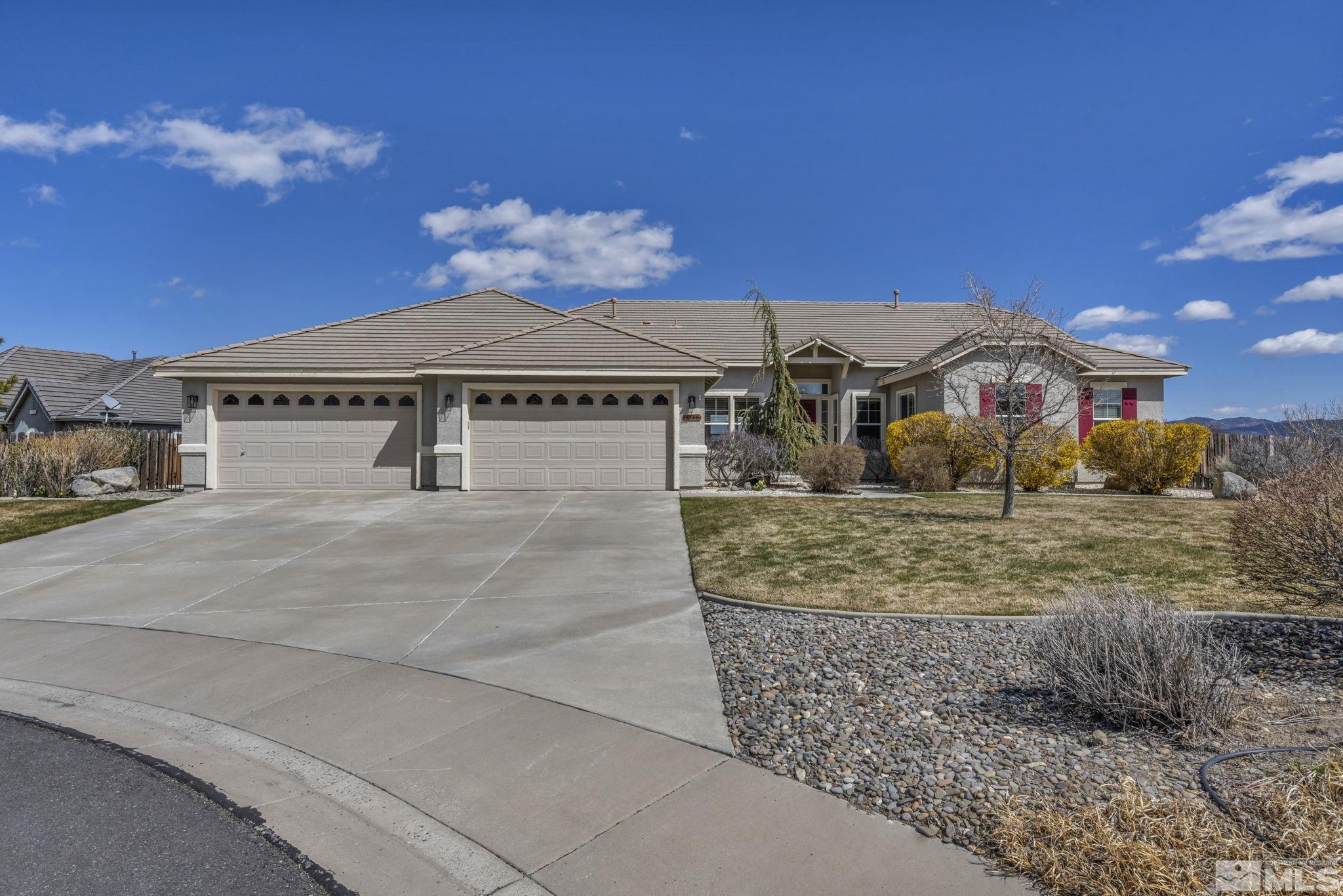 5544 New Mexico Court Reno, NV 89511 - Photo 1 of 39 a front view of a house with a yard