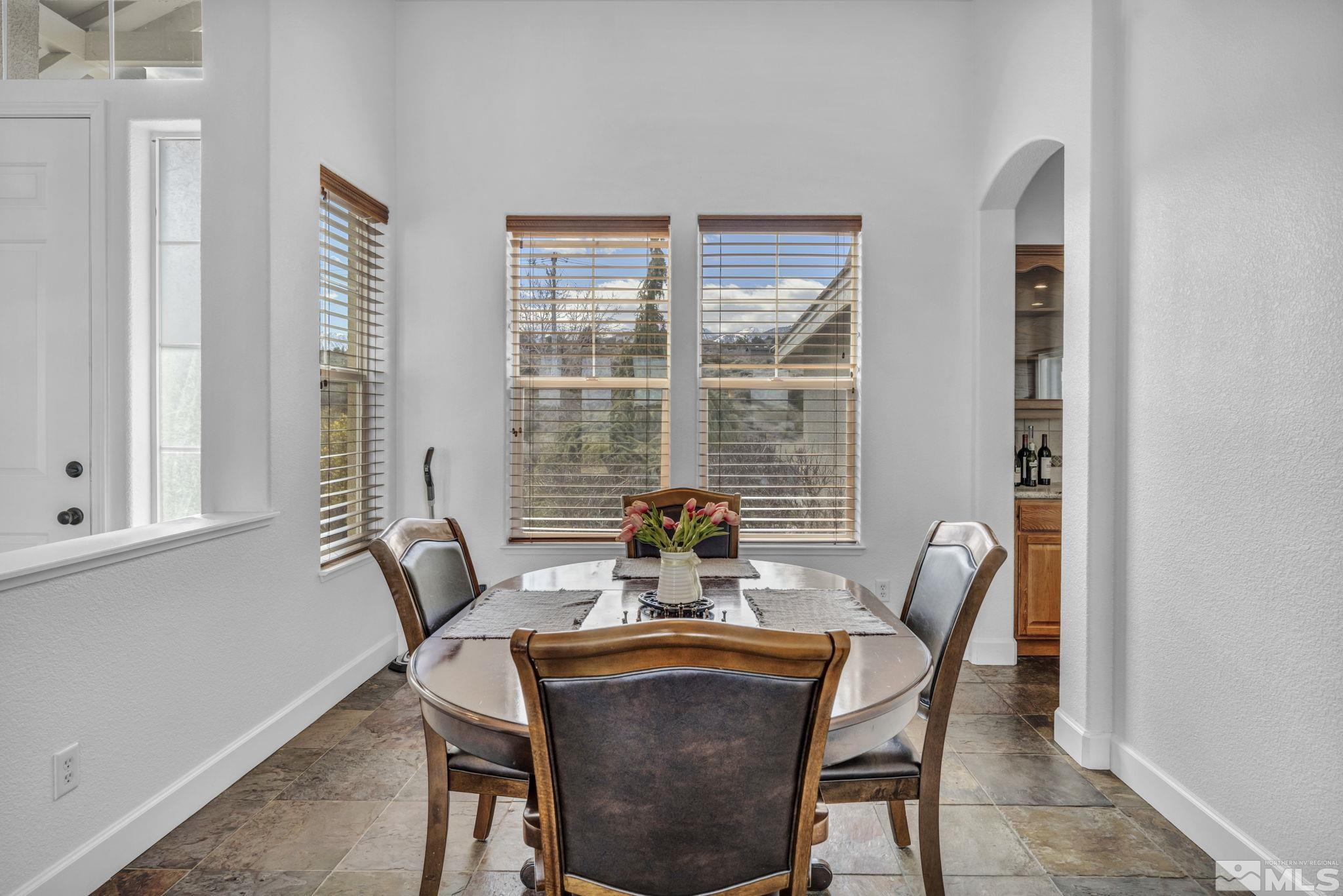 5544 New Mexico Court Reno, NV 89511 - Photo 14 of 39 a dining room with furniture and window