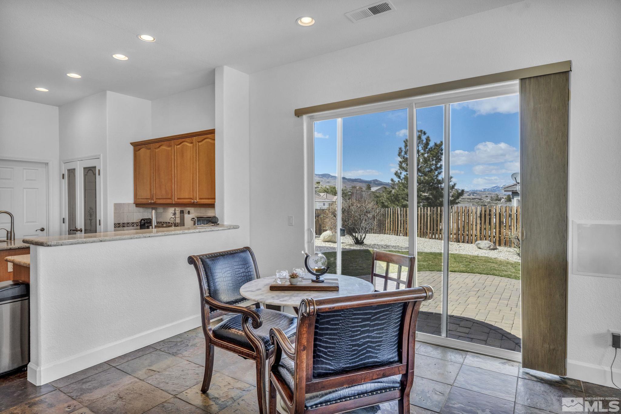 5544 New Mexico Court Reno, NV 89511 - Photo 7 of 39 a view of a dining room with furniture window and outside view
