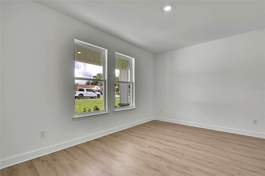 6589 Freeport Drive Spring Hill, FL 34608 - Photo 41 of 63 wooden floor in an empty room with a window