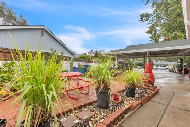 a view of a swimming pool with a patio