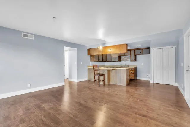 a living room with a table and chairs