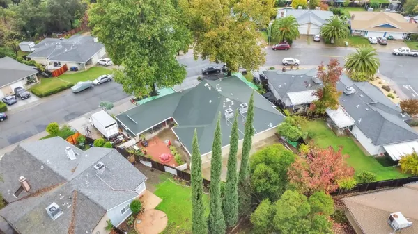 an aerial view of a house with yard swimming pool and outdoor seating