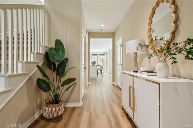 a dining room with furniture and wooden floor