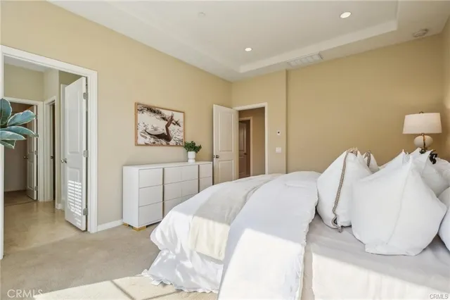 a bedroom with a bed and a couch