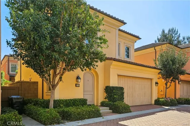 front view of a house with a tree
