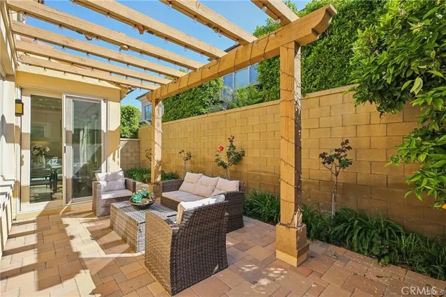 a view of a patio with couches and potted plants