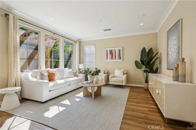 a living room with furniture rug and a large window