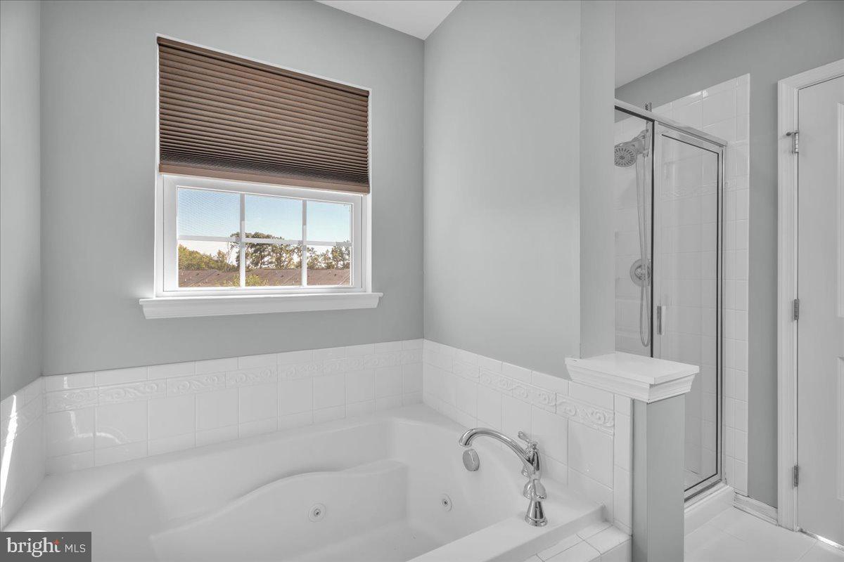 34 Wallace Road Mount Holly, NJ 08060 - Photo 15 of 28 a white bath tub sitting in a bathroom