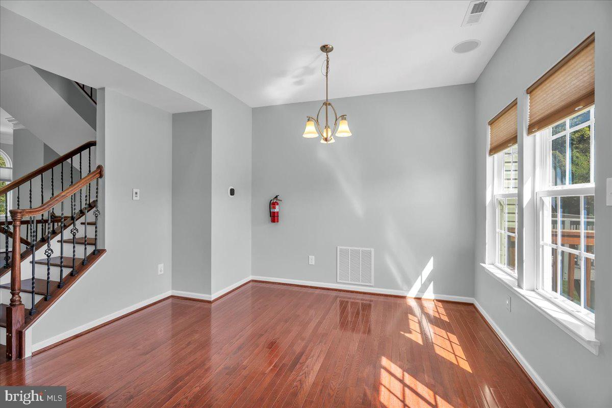 34 Wallace Road Mount Holly, NJ 08060 - Photo 3 of 28 a view of an empty room with wooden floor and a window