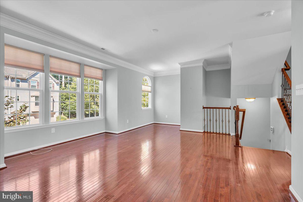 34 Wallace Road Mount Holly, NJ 08060 - Photo 10 of 28 a view of an empty room with wooden floor and a window