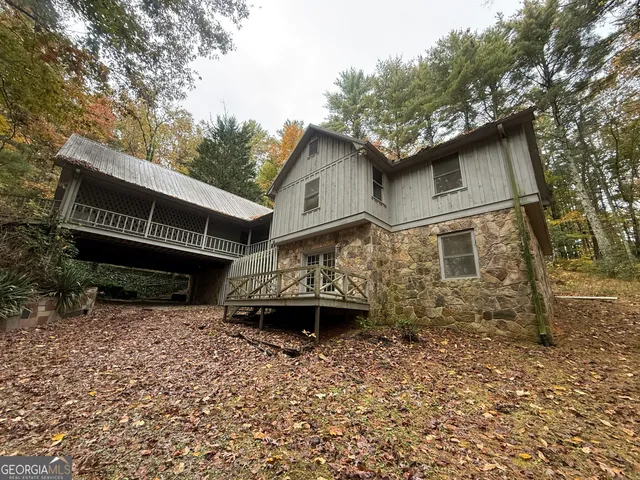 a house with trees in the background