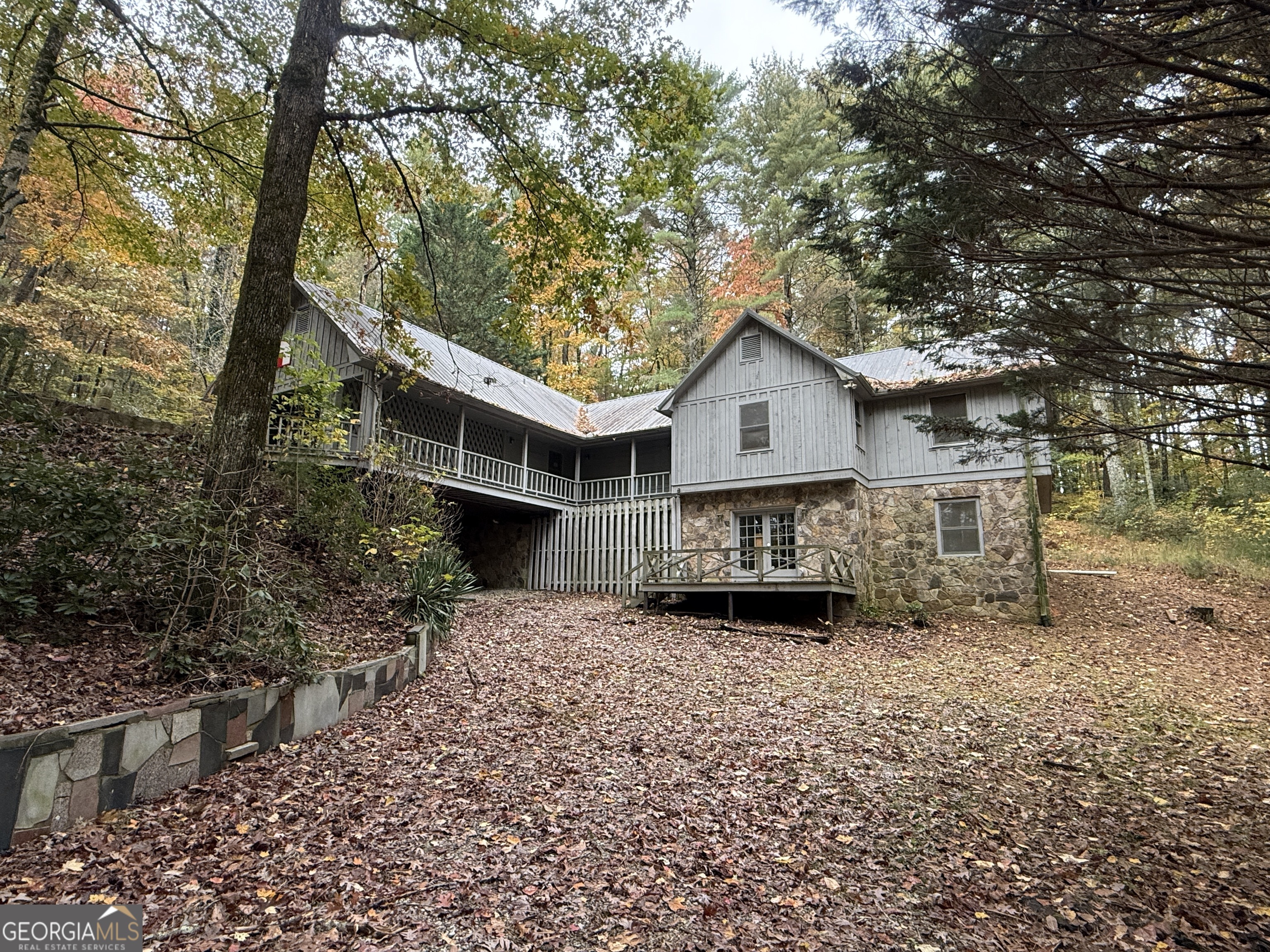 3197 Bridge Creek Road Tiger, GA 30576 - Photo 2 of 30 a view of a house with a tree in the yard