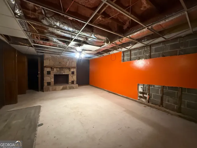 a view of an empty room with windows