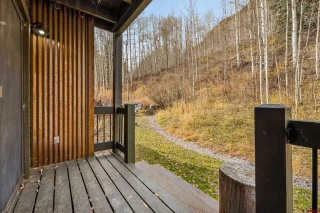 a view of balcony with wooden floor