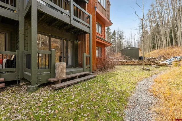 a view of a brick house with many windows