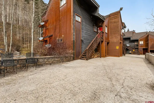 a view of a house with a snow in the yard