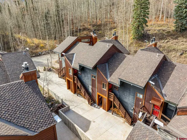 a view of a patio with a table and chairs