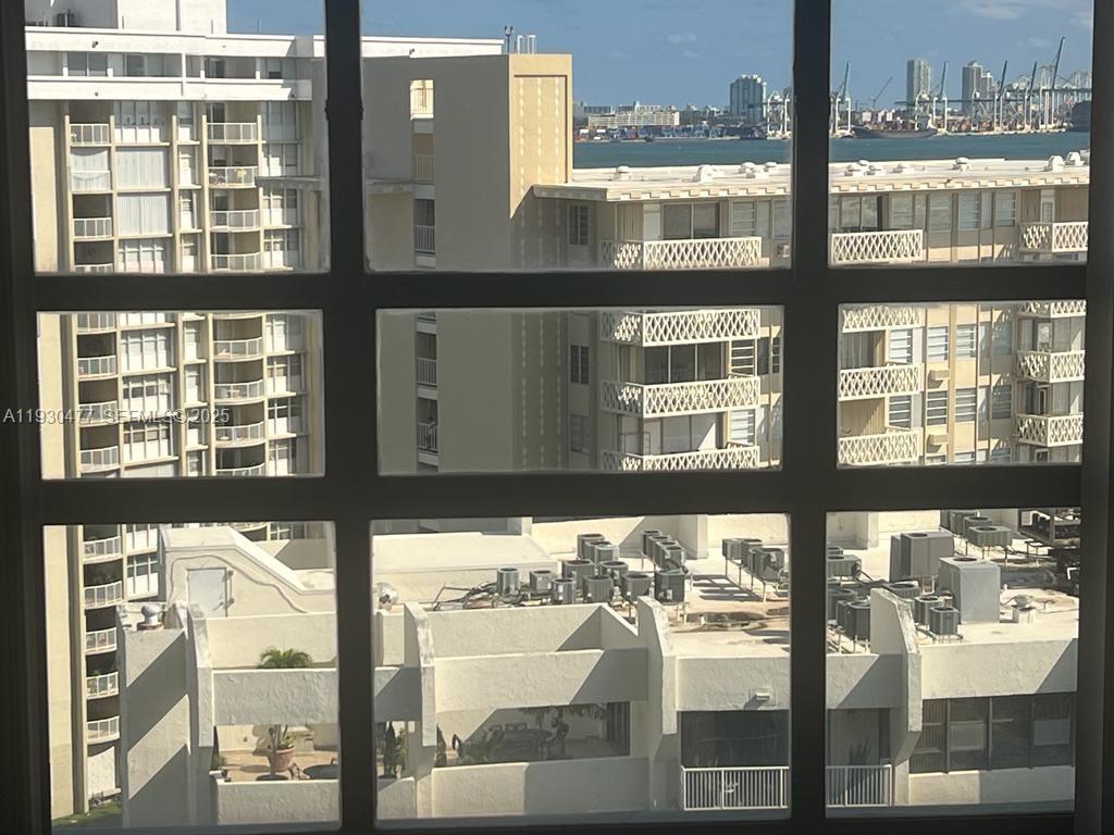 1450 Brickell Bay Drive, Unit 1606 Miami, FL 33131 - Photo 25 of 39 a view of a building from a city from a window
