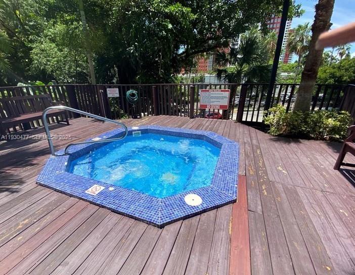 1450 Brickell Bay Drive, Unit 1606 Miami, FL 33131 - Photo 28 of 39 a view of outdoor seating space with wooden floor