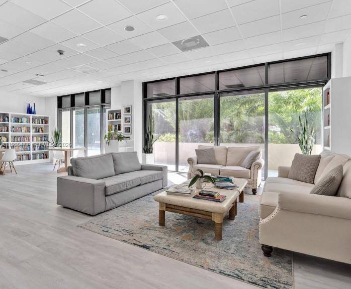 1450 Brickell Bay Drive, Unit 1606 Miami, FL 33131 - Photo 33 of 39 a living room with furniture and a large window