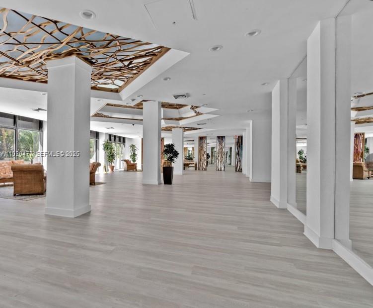 1450 Brickell Bay Drive, Unit 1606 Miami, FL 33131 - Photo 34 of 39 a view of entryway livingroom and hall with wooden floor