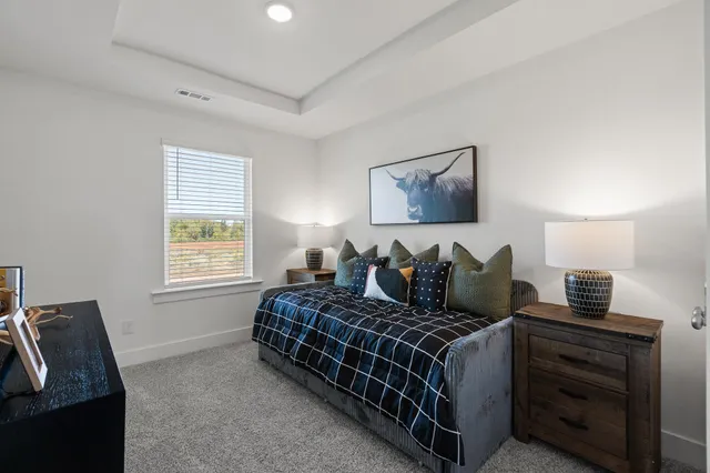 a bed room with bed and a window