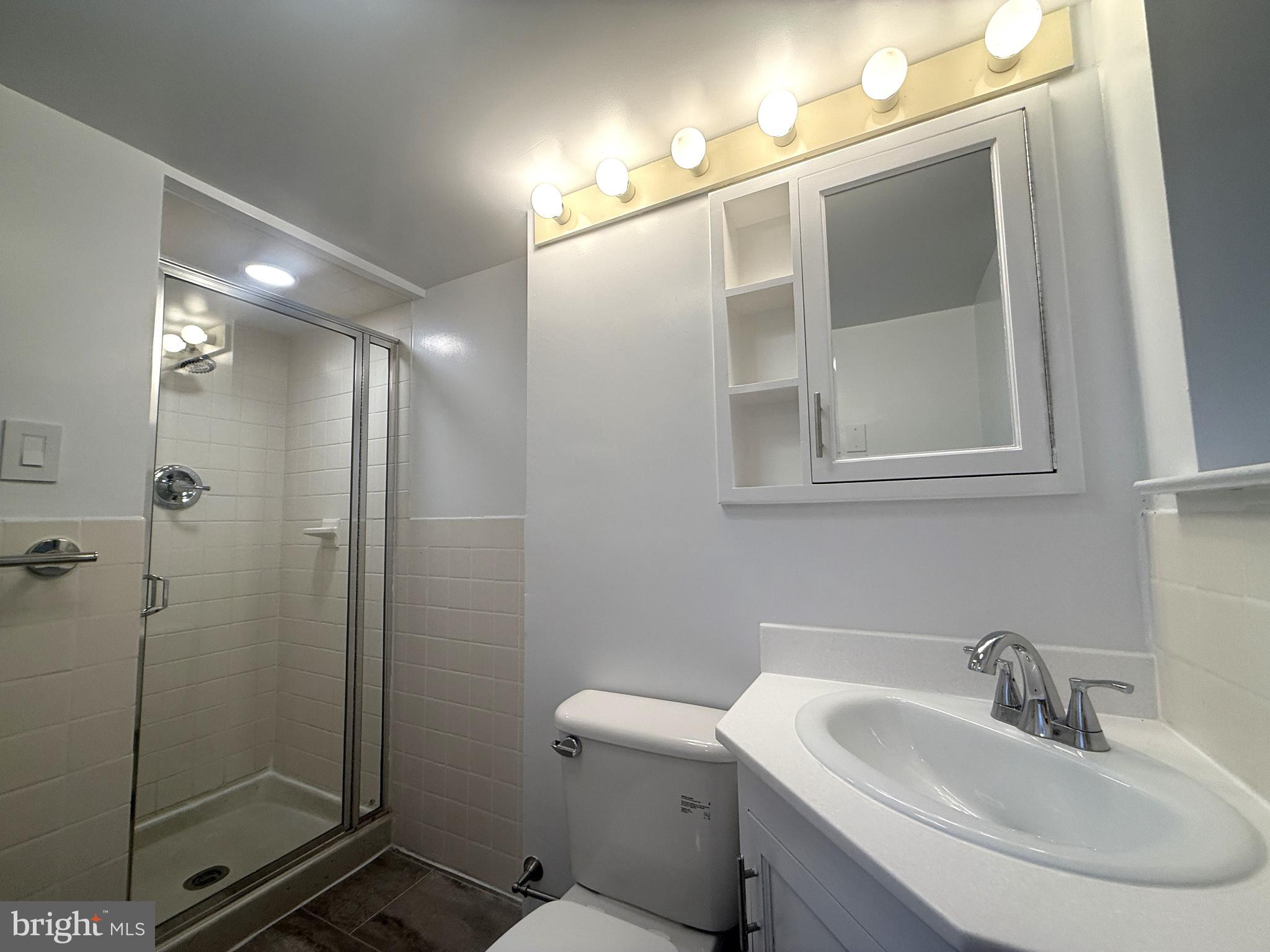 606 Cooper Landing Road, Unit B2K Cherry Hill, NJ 08002 - Photo 19 of 21 a bathroom with a sink and mirror