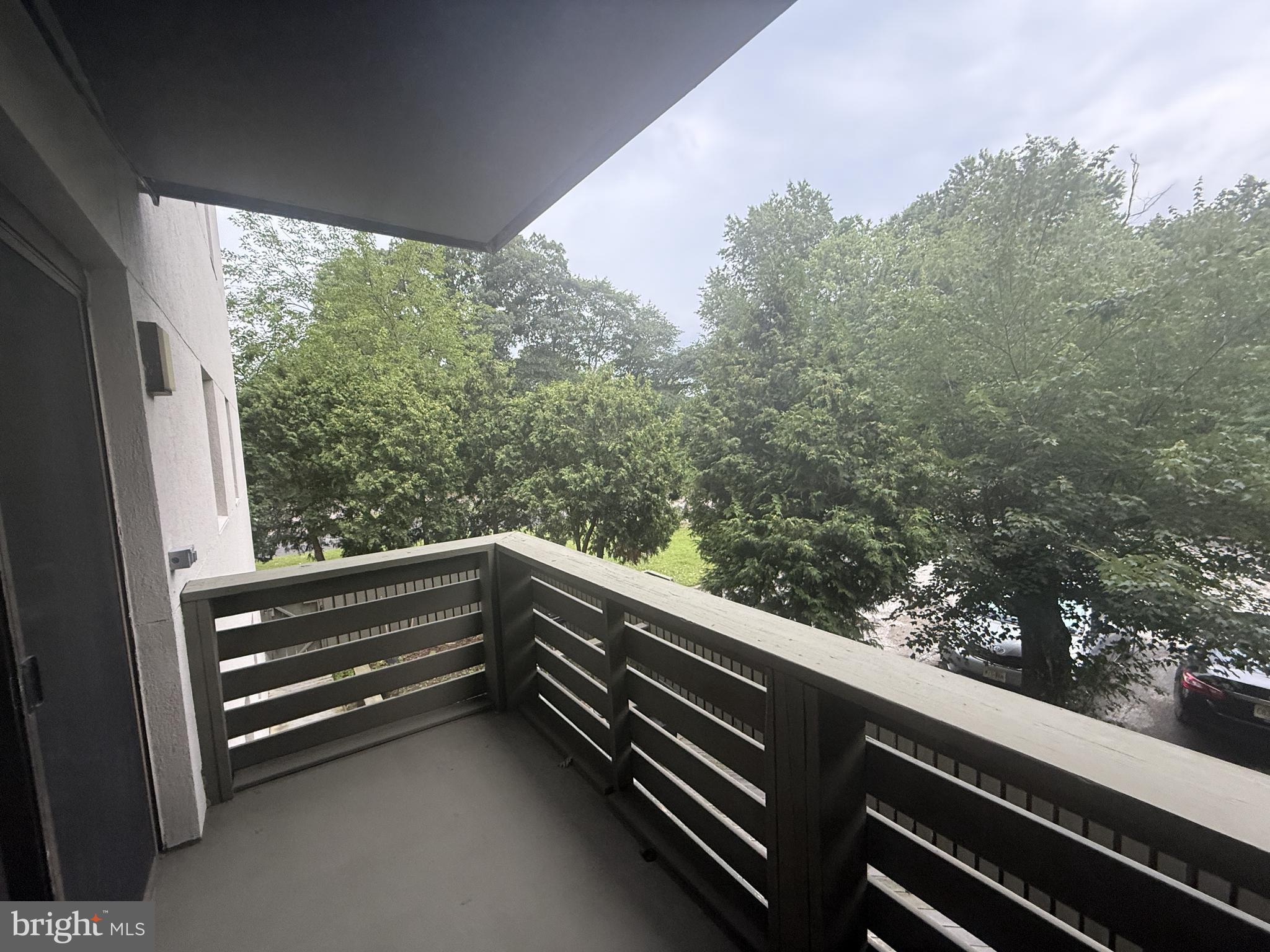 606 Cooper Landing Road, Unit B2K Cherry Hill, NJ 08002 - Photo 20 of 21 a view of balcony with wooden floor and fence
