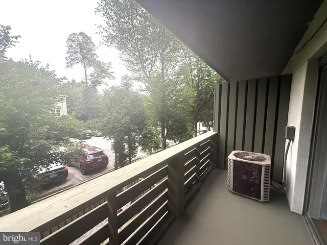 a view of two chairs in the balcony