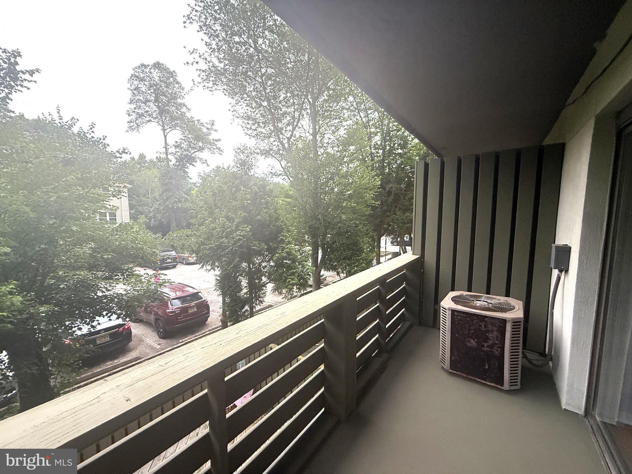 606 Cooper Landing Road, Unit B2K Cherry Hill, NJ 08002 - Photo 21 of 21 a view of two chairs in the balcony