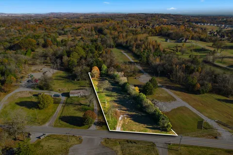 a view of a yard with an outdoor space