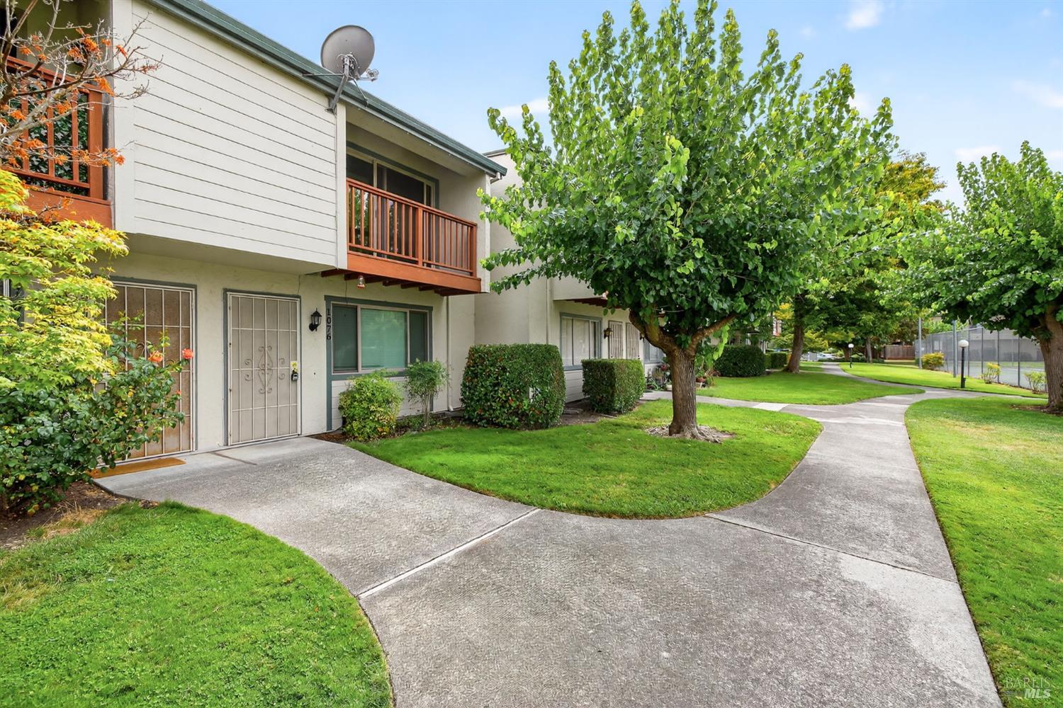 1076 Eleanor Avenue Rohnert Park, CA 94928 - Photo 1 of 1 a front view of a house with a yard and trees