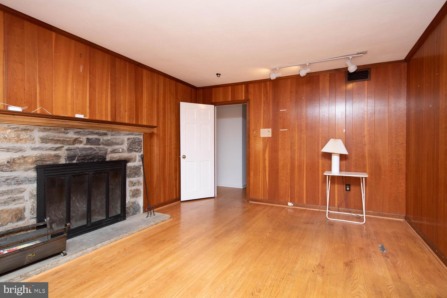 1134 Devon Road Jenkintown, PA 19046 - Photo 11 of 40 Paneled den with wood burning fireplace