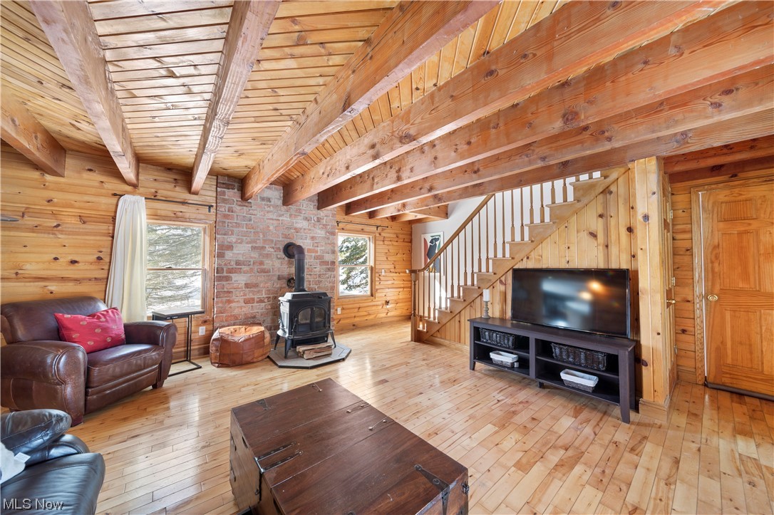 7774 Sidley Road Thompson, OH 44086 - Photo 16 of 29 Living room with wood burner for those chilly days and nights.