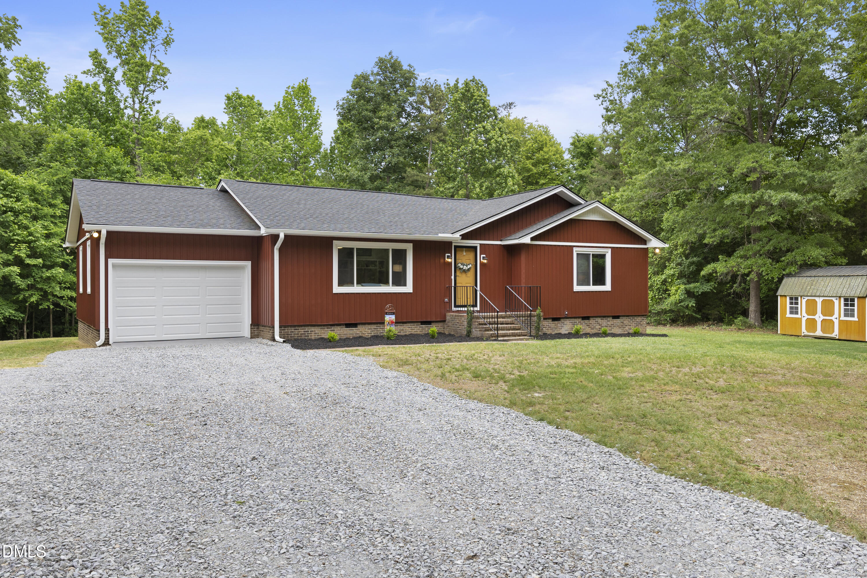 2168 Lakewood Falls Road Goldston, NC 27252 - Photo 5 of 30 a front view of a house with a garden