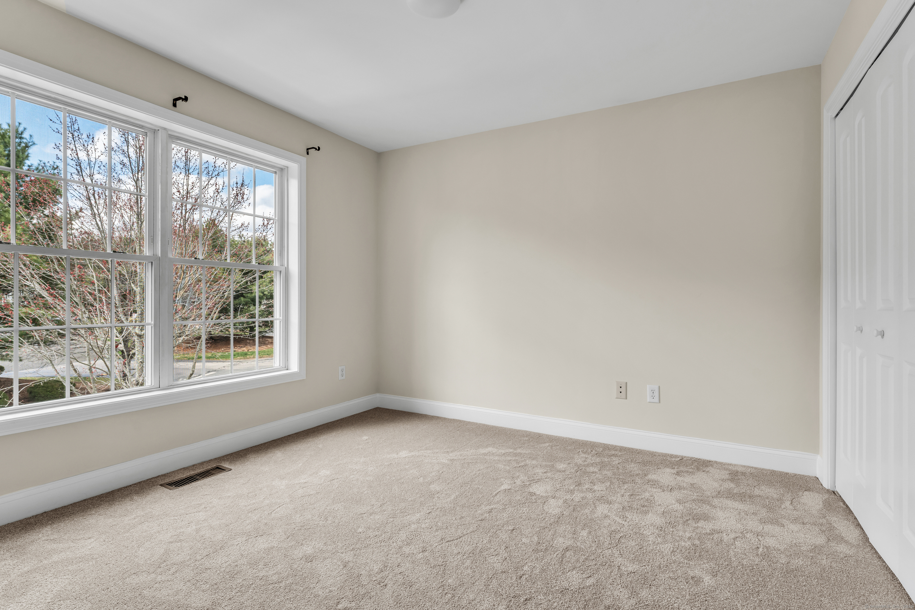 15 Freedom Way, Unit 92 Niantic, CT 06357 - Photo 17 of 33 a view of an empty room with a window